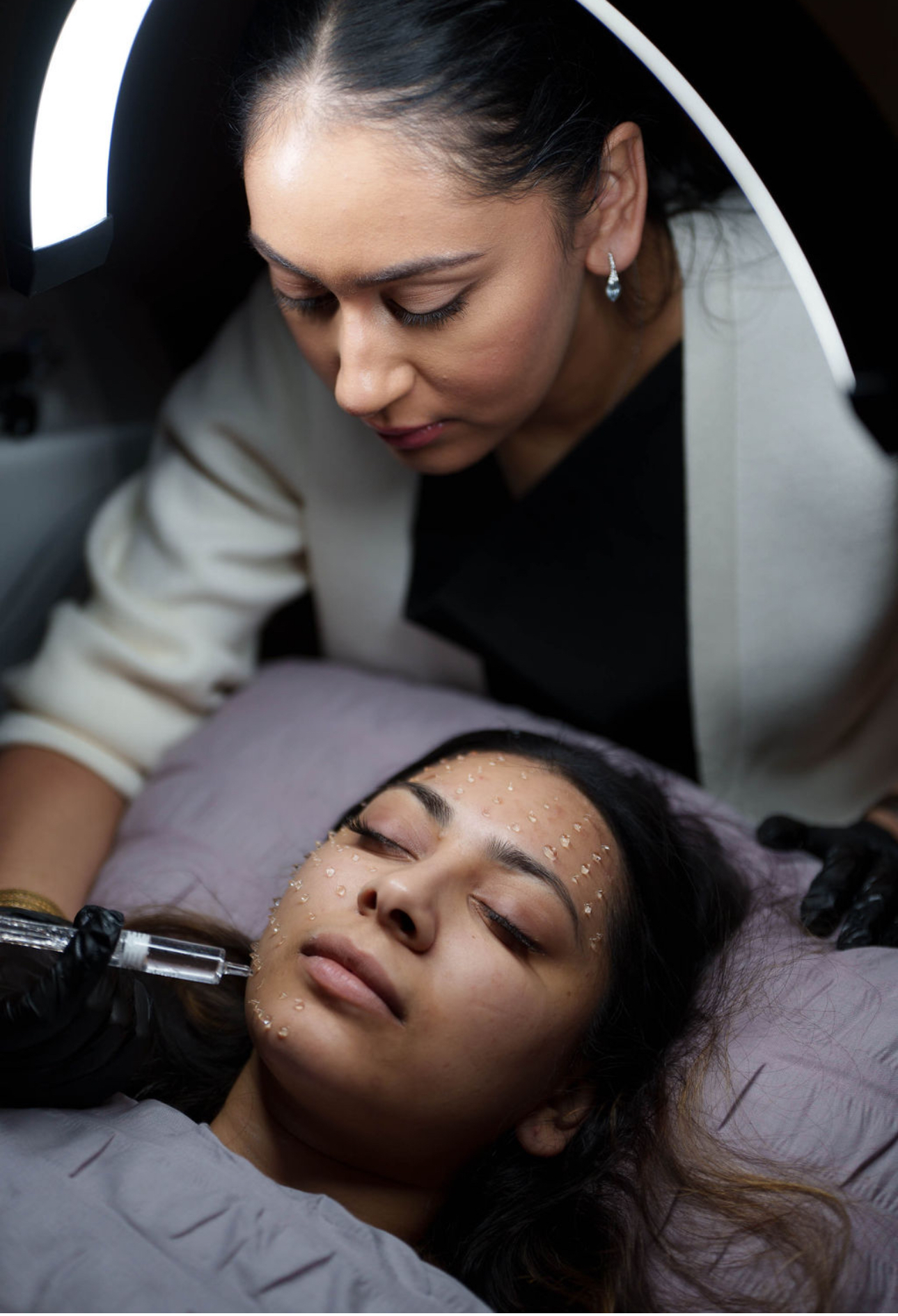 Sim Kaur carrying out a treatment at SKR Beauty